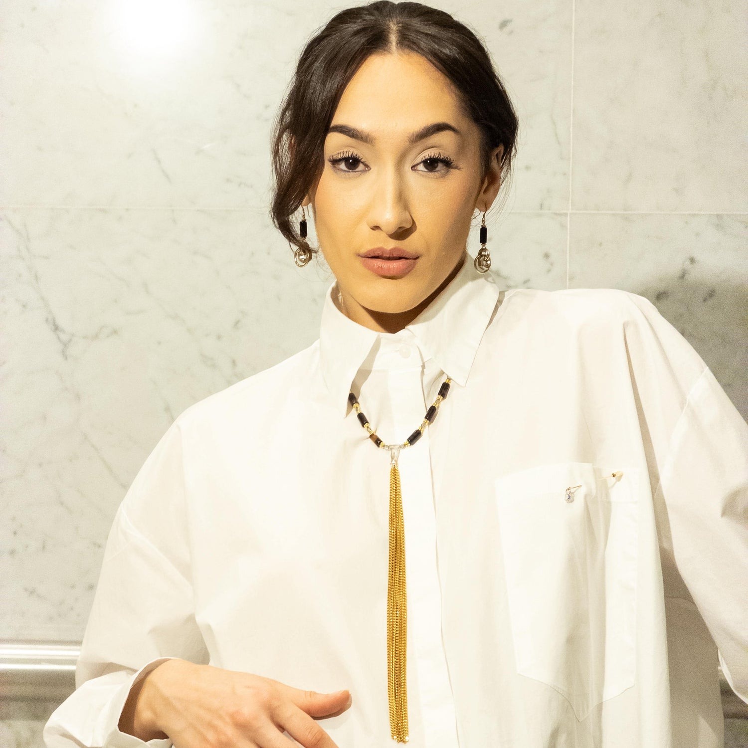 A model wearing MONOXIDE jewellery
